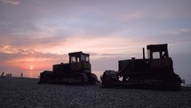 Bulldozers at the Sunset by the Sea