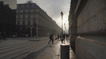 Paris, France - People Commute, Cars, Bike at Rue De Rivoli Street Morning Warm Sunrise