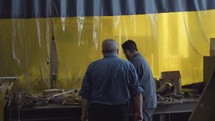 men walking through a warehouse 