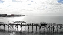 aerial view over a broken pier 