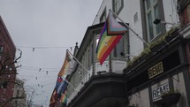 The rainbow LGBTQ flag and attributes on Canal Street, in the Gay Village of Manchester, UK.