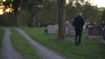 a man visiting a cemetery 
