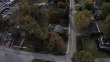 Drone over fall foliage in small town