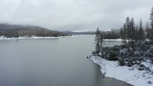 aerial view over Bass Lake in winter 