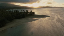 aerial view over a beach at sunrise 