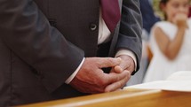 Close up of person hands in church