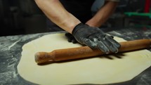 Rolling Out Homemade Dough With Wooden Rolling Pin A Lasagna In A Kitchen