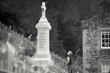 grave monument - boy looking up at it