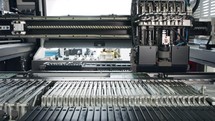 SMT machine places resistors, capacitors, transistors, LED and integrated circuits on circuit boards at high speed