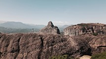 woman walking on the top of a mountain