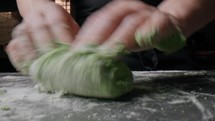 Hands Of A Professional Chef Handle The Dough Of Green Spaghetti Food