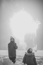 kids watching fireworks in the snow 