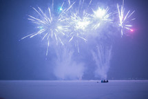 kids watching fireworks in the snow 
