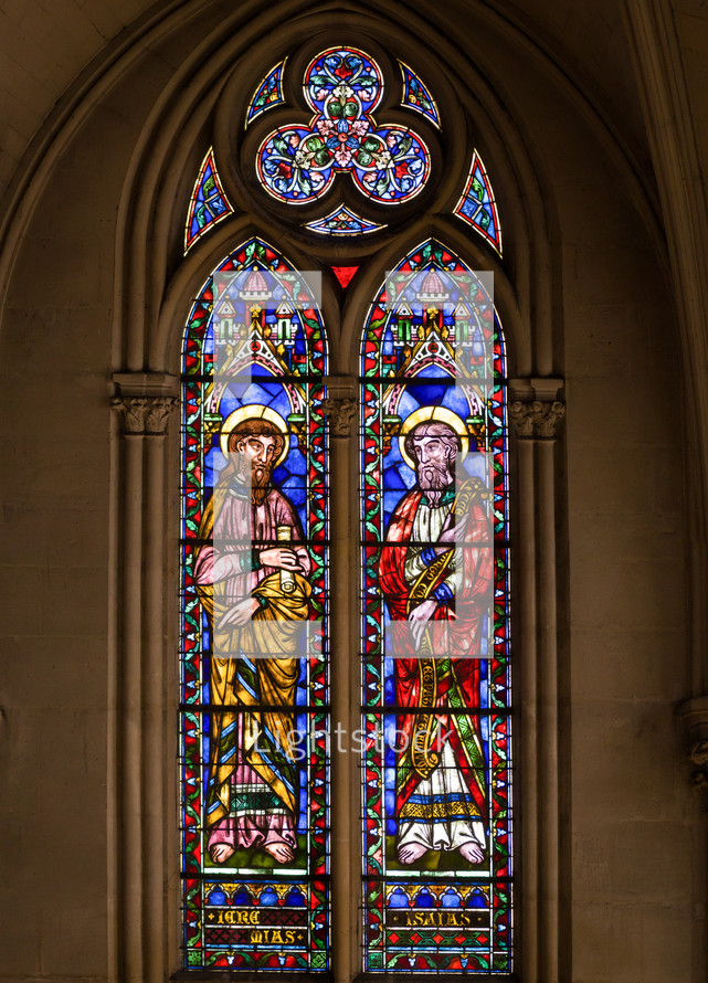 stained glass windows depict biblical scenes, saints, angels, and other religious symbols.