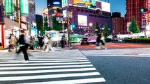 TOKYO - OCT 1st, 2022: People crossing an intersection in Kabukicho entertainment district in Shinjuku, Tokyo
