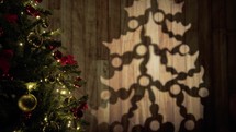 Lights and decorations on a christmas tree with shadows from window 