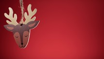 Reindeer Christmas decoration with red background 