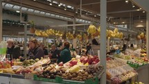 Porto, Portugal - April 8, 2024: Early morning at Bolhão Market in Porto, the fruit, meat and vegetable vendors have already opened their stalls.