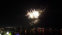 Fireworks over water with Boats watching