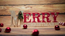 Merry Christmas sign on a wooden background