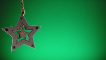 Star Christmas decoration with green background 