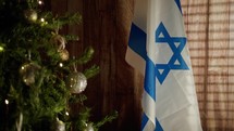 Israel flag near Christmas tree