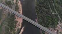 Bridge with traffic over the river aerial drone footage