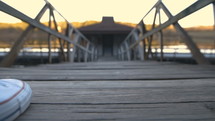 a woman walking on a pier 