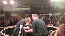 dunking baptism during a worship service 