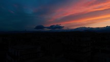 Stunning red sunset over the city silhouettes