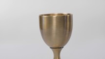 Communion cup on white background
