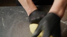 Hands Of A Chef Mixing The Dough For Spaghetti Pasta At Restaurant