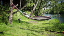 Empty hammock. Ripple lake water. Vacation.
