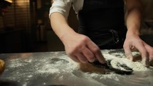 Chef Mixes The Dough With Flour Eggs And Cuttlefish Ink Food Into Restaurant