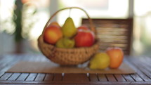 Organic fruits in a basket. Dolly shot. Shot in Cinestyle color profile  (good for color grading).