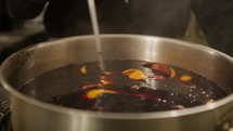 Boiling wine traditional Calabrian drink in pot