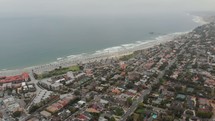 aerial view over a suburbs along a shoreline 