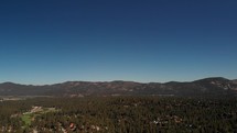 Aerial Shot Panning Down Over Homes in Big Bear, California