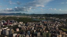 Aerial view city of buildings, mountains and clouds in Tirana Albania
