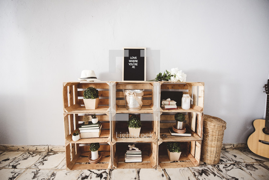 crates used as shelves and house plants 