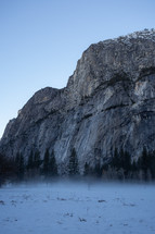 Mountain with trees and snow in Yosemite