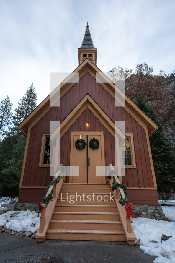 Small church at Christmas with snow