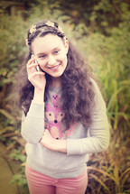 teen girl talking on a cellphone 