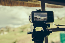 camera filming on a tripod