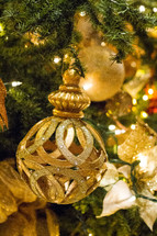 gold ornaments on a Christmas tree 