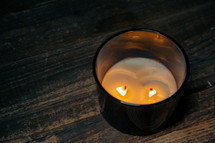 Two wick candle burning