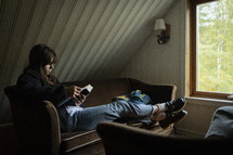 Woman reading her Bible in a quiet room with natural window light