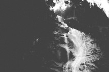 moody black and white of waterfall and forest