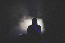 fog machine, man, on stage, microphone