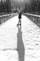 woman standing outdoors in snow 